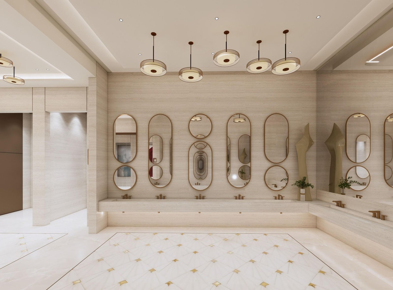 A wash wall of gold-framed oval mirrors over a long stone counter, glass pendant lights above